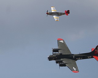 A B-17 Bomber and a P-51 Mustang fly during the Thunder Over the Valley Air Show at the Youngstown Air Reserve Station, Saturday, June 17, 2017 in Vienna...(Nikos Frazier | The Vindicator)