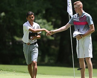 Conner Stevens(right) shakes Kahmar Byers' hand after completing hole 18 during the first round of the AJGA Mill Creek Foundation Junior All-Star, Tuesday, June 2017, 2017 at Mill Creek Golf Course. ..(Nikos Frazier | The Vindicator)..