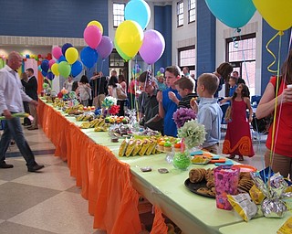 Neighbors | Alexis Bartolomucci.Students, families and teachers from Dobbins Elementary picked out items from the snack table during the Fourth Grade Celebration.