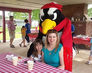 Neighbors | Submitted.Victoria and mom, Danielle Jones, are shown with Youngstown State University’s "Pete the Penguin" in the picnic pavilion at Austintown Community Church for the 2017 “Celebrate Families Picnic” at the A.C.C. Preschool Childcare Center.