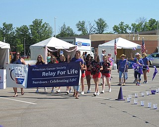 Neighbors | Alexis Bartolomucci.Samantha Skowren and her mother led the survivor lap on June 3 at the Austintown Relay for Life at Austintown Elementary School.
