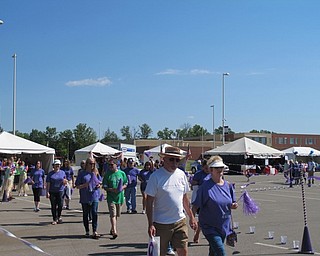 Neighbors | Alexis Bartolomucci.Survivors walked the survivor lap at Austintown Elementary School for the Relay for Life opening ceremony on June 3.