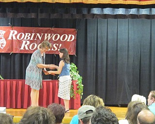 Neighbors | Alexis Bartolomucci.Fourth-grade teacher Doreen Miner gave a diploma and shook the hand of her student as she walked across the stage for the Robinwood Lane Elementary fourth grade graduation.