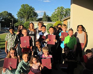 Neighbors | Alexis Bartolomucci.Doreen Miner stood with her fourth-grade students on May 31 after their graduation ceremony at Robinwood Lane Elementary.