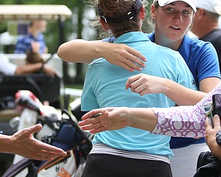 Taylor Kehoe of Strathroy, Canada(back) and Sarah Beqaj of Toronto hug after completing the third and final round of the AJGA Mill Creek Foundation Junior All-Star, Thursday, June 22, 2017 at Mill Creek Golf Course. ..(Nikos Frazier | The Vindicator)..