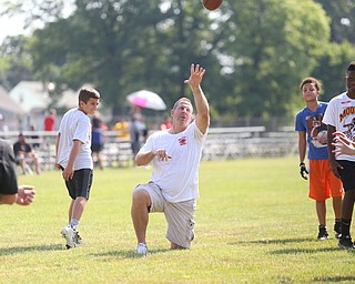 YSU Football head coach Bo Pelini prepares to throw the ball during the Cardinal Mooney Football Camp at Cardinal Mooney High School, Thursday, June 22, 2017 in Youngstown...(Nikos Frazier | The Vindicator)