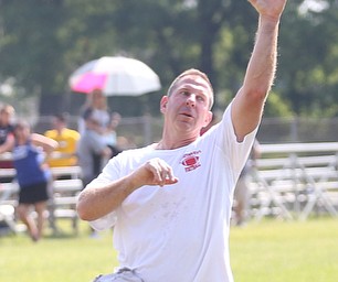 YSU Football head coach Bo Pelini prepares to throw the ball during the Cardinal Mooney Football Camp at Cardinal Mooney High School, Thursday, June 22, 2017 in Youngstown...(Nikos Frazier | The Vindicator)