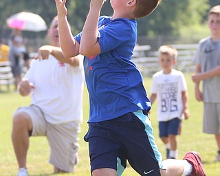 Luke Houck(9) of Boardman prepares to catch a pass from YSU Football head coach Bo Pelini during the Cardinal Mooney Football Camp at Cardinal Mooney High School, Thursday, June 22, 2017 in Youngstown...(Nikos Frazier | The Vindicator)
