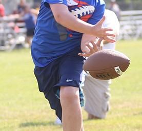Luke Houck(9) of Boardman prepares to catch a pass from YSU Football head coach Bo Pelini during the Cardinal Mooney Football Camp at Cardinal Mooney High School, Thursday, June 22, 2017 in Youngstown...(Nikos Frazier | The Vindicator)