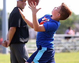 Luke Houck(9) of Boardman prepares to catch a pass from YSU Football head coach Bo Pelini during the Cardinal Mooney Football Camp at Cardinal Mooney High School, Thursday, June 22, 2017 in Youngstown...(Nikos Frazier | The Vindicator)