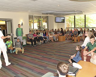 SPECIAL TO THE VINDICATOR
Daniel Schlueter, a 2013 graduate of West Branch High School and a midshipman at the United States Naval Academy, speaks to West Branch Middle School students at the University of Mount Union.