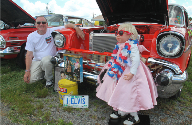 William D. Lewis The Vindicator Jerry Apger of Lordstown shows off his 1957 Chevy with a Barbie Doll and other 1950's memorabilia at the Hot Rod Super Nationals 6-24-17 at the Canfield Fairgrounds.