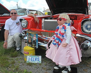 William D. Lewis The Vindicator Jerry Apger of Lordstown shows off his 1957 Chevy with a Barbie Doll and other 1950's memorabilia at the Hot Rod Super Nationals 6-24-17 at the Canfield Fairgrounds.