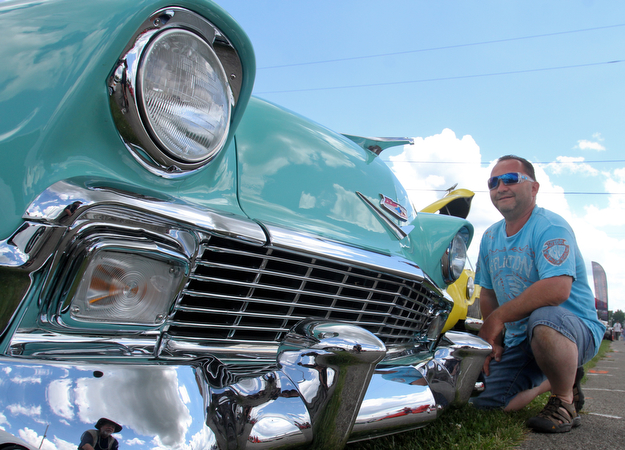 William D. Lewis The Vindicator  Dan Patrone a longtime car enthusiast  from Poland, is all smiles as he shows his 1956 Chevy at the Hot Rod Super Nationals 6-24-17 at the Canfield Fairgrounds.
