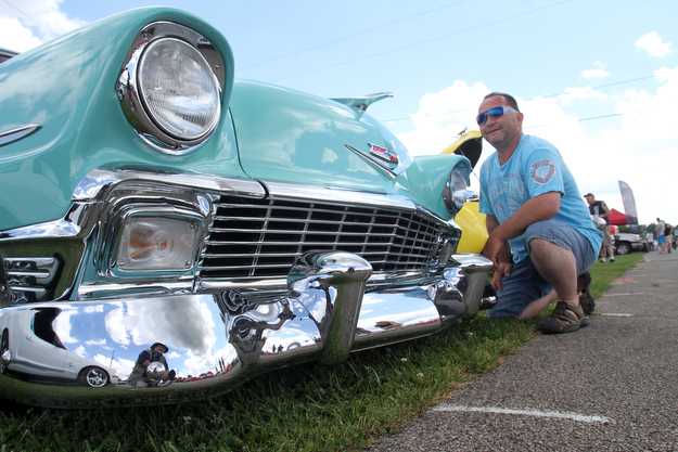William D. Lewis The Vindicator  Dan Patrone a longtime car enthusiast  from Poland, is all smiles as he shows his 1956 Chevy at the Hot Rod Super Nationals 6-24-17 at the Canfield Fairgrounds.