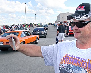 William D. Lewis The Vindicator   Steve Cornell of Hubbard takes photos of hot rods at SP Mall for Hot Rod Super NAtionals afterparty 6-24-17.