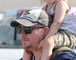 Ian Wills of Austintown holds his son Foster, 2, on his shoulders at SP Mall for Hot Rod Super Nationals afterparty 6-24-17.
