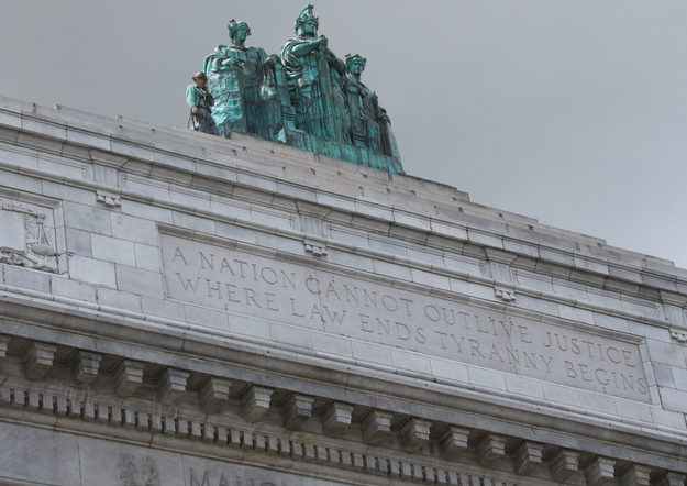     ROBERT K. YOSAY  | THE VINDICATOR..the newly-restored copper statues were returned to its roof of the courthouse..The statues, removed in October 2010, have been returned to their perch above the courthouse's main entrance where they had sat since 1909...The three hollow statues, which were restored by an Oberlin firm, are named ÒJustice,Ó on the left, ÒStrength and AuthorityÓ in the center; and ÒLawÓ on the right.