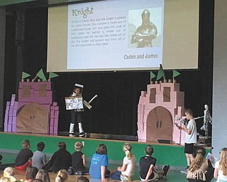 SPECIAL TO THE VINDICATOR
Damascus Elementary School participated in Right to Read week in May with many activities such as reading 20 minutes per evening, hosting a trash bash recycled fashion show and a spelling bee for third and fourth grade. Above, left are James Mincks dressed as a knight made of recycled material and Caden Zion who explained to the audience about the costume.