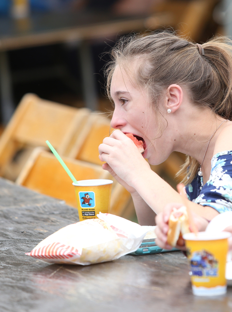 Kiersten Donahue(13) eats some watermelon during the 19th annual Struthers Day at Mauthe Park, Thursday, June 29, 2017 in Struthers...(Nikos Frazier | The Vindicator)