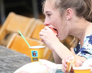 Kiersten Donahue(13) eats some watermelon during the 19th annual Struthers Day at Mauthe Park, Thursday, June 29, 2017 in Struthers...(Nikos Frazier | The Vindicator)