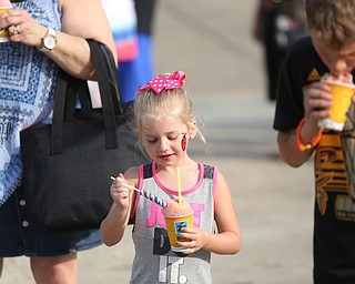 Laula Wildes(5) enjoys a Kona Ice during the 19th annual Struthers Day at Mauthe Park, Thursday, June 29, 2017 in Struthers...(Nikos Frazier | The Vindicator)