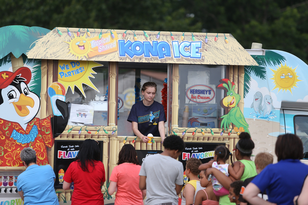 Zoe Oswald of Kona Ice hands out ice cups during the 19th annual Struthers Day at Mauthe Park, Thursday, June 29, 2017 in Struthers...(Nikos Frazier | The Vindicator)