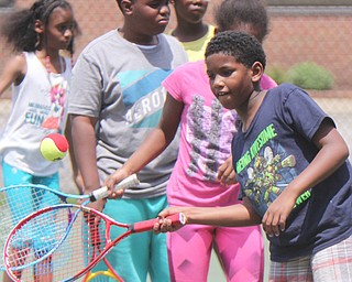 William D. Lewis The vindicator  Aiden Brown , 8, of Youngstown participates in a tennis program at he JCC 6-29-17.