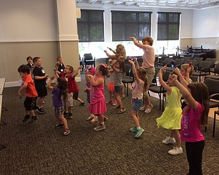 Neighbors | Abby Slanker.Members of the Canfield United Methodist Preschool pre-kindergarten class, along with their teachers, danced to a song about bugs during a visit to the library.