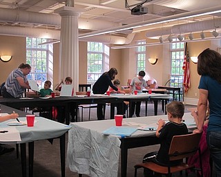 Neighbors | Alexis Bartolomucci.Children and their family members worked on a kite painting on May 22 at the Poland library during Almost Summer Paint Party.