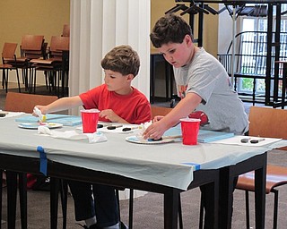 Neighbors | Alexis Bartolomucci.Children worked on painting a background on their canvas during the Painting Party at the Poland library.