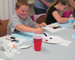 Neighbors | Alexis Bartolomucci.One of the children worked on his painting on May 22 at the Poland library during the Painting Party event.