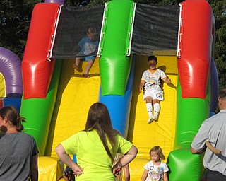 Neighbors | Alexis Bartolomucci.Children slid down the inflatable slide during the Boardman Schools 100th Community Celebration on June 3 at Boardman High School.