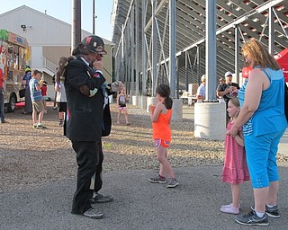 Neighbors | Alexis Bartolomucci.A clown prepared to make a balloon animal for one of the children at Spartan Stadium on June 3 for the Boardman Schools 100th Community Celebration.