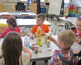 Neighbors | Alexis Bartolomucci.Poland North Preschool students made sensory bottles using water, oil, glitter and food coloring during their fun day on May 26.