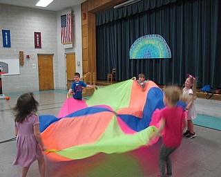 Neighbors | Alexis Bartolomucci.Students played with a parachute during the fun day at Poland North Preschool on May 26.