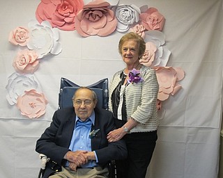 Neighbors | Alexis Bartolomucci.Herb and Mary posed in front of the back drop on June 8 for the Brookdale prom event.