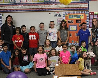 Neighbors | Abby Slanker.Hilltop Elementary School students in Marie Rupert’s third-grade class became mini entrepreneurs as they created their own business and donated their profits to Angels for Animals. Julie Meier, Angels for Animals outreach manager, (far left) and Mindy, a dog up for adoption at Angels for Animals, (front, right) visited the school to accept the donation on May 31.