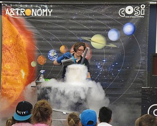 Neighbors | Alexis Bartolomucci.COSI Outreach Educator Lindy Newman made a comet using liquid nitrogren, dust and other common objects to show the guests at the Astounding Astronomy COSI program on June 13 at the Boardman library.