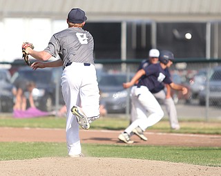 Baird pitcher Ryan Weaver(9) throws to first to stop a runner from stealing to second during the 1st inning as Roth Brothers takes on Baird Brothers, Friday, June 30, 2017 at Bob Cene Park. Play was stopped in the 6th inning due to a lightning delay then never resumed because of heavy rain...(Nikos Frazier | The Vindicator)..