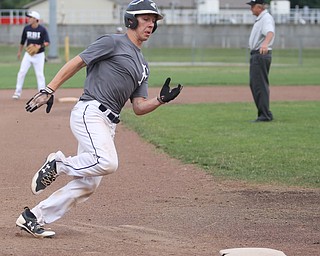 Baird runner Coleman Stauffer(20) rounds third during the 3rd inning as Roth Brothers takes on Baird Brothers, Friday, June 30, 2017 at Bob Cene Park. Play was stopped in the 6th inning due to a lightning delay then never resumed because of heavy rain...(Nikos Frazier | The Vindicator)..