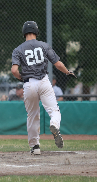 Baird runner Coleman Stauffer(20) scores a run during the 3rd inning as Roth Brothers takes on Baird Brothers, Friday, June 30, 2017 at Bob Cene Park. Play was stopped in the 6th inning due to a lightning delay then never resumed because of heavy rain...(Nikos Frazier | The Vindicator)..