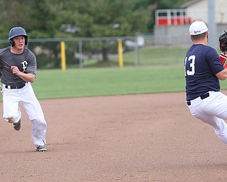 Baird runner Dom Bucko(5) looks at Roth third baseman Tyler Srbinovich(13) during the 3rd inning as Roth Brothers takes on Baird Brothers, Friday, June 30, 2017 at Bob Cene Park. Play was stopped in the 6th inning due to a lightning delay then never resumed because of heavy rain...(Nikos Frazier | The Vindicator)..