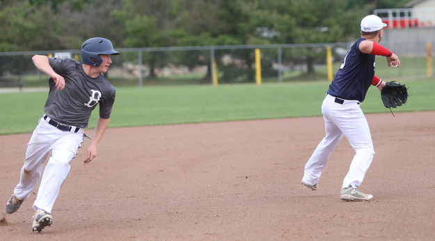 Baird runner Dom Bucko(5) looks at Roth third baseman Tyler Srbinovich(13) during the 3rd inning as Roth Brothers takes on Baird Brothers, Friday, June 30, 2017 at Bob Cene Park. Play was stopped in the 6th inning due to a lightning delay then never resumed because of heavy rain...(Nikos Frazier | The Vindicator)..