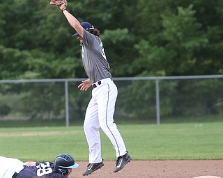 Roth runner William Valentini(28) reaches out to slide into second base as Baird second baseman Jeff Wehler(37) jumps up for the pass during the 3rd inning as Roth Brothers takes on Baird Brothers, Friday, June 30, 2017 at Bob Cene Park. Play was stopped in the 6th inning due to a lightning delay then never resumed because of heavy rain...(Nikos Frazier | The Vindicator)..