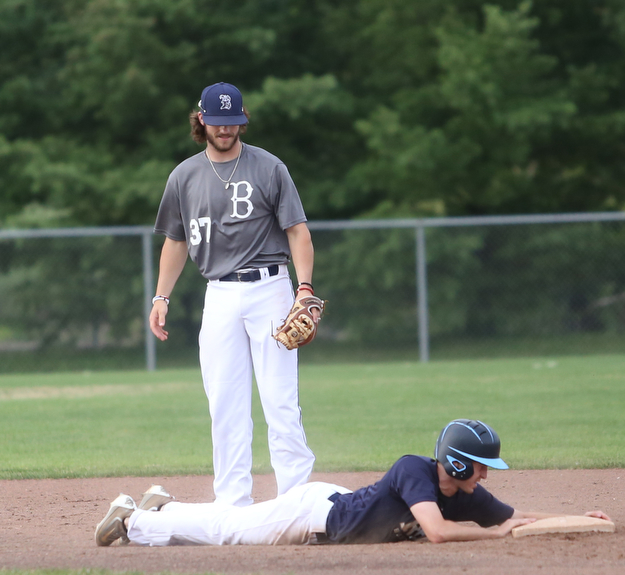 Roth runner William Valentini(28) reaches onto second base as Baird second baseman Jeff Wehler(37) looks down during the 3rd inning as Roth Brothers takes on Baird Brothers, Friday, June 30, 2017 at Bob Cene Park. Play was stopped in the 6th inning due to a lightning delay then never resumed because of heavy rain...(Nikos Frazier | The Vindicator)..