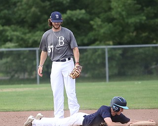 Roth runner William Valentini(28) reaches onto second base as Baird second baseman Jeff Wehler(37) looks down during the 3rd inning as Roth Brothers takes on Baird Brothers, Friday, June 30, 2017 at Bob Cene Park. Play was stopped in the 6th inning due to a lightning delay then never resumed because of heavy rain...(Nikos Frazier | The Vindicator)..