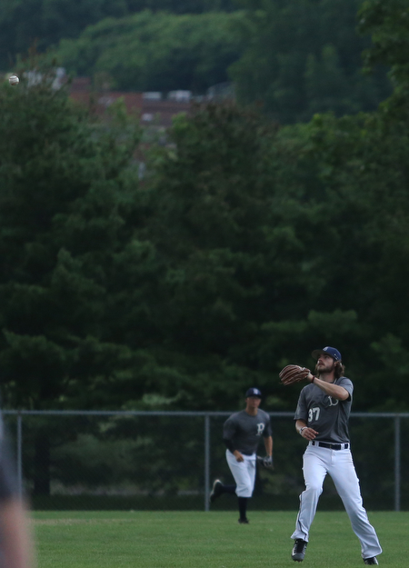 Baird second baseman Jeff Wehler(37) looks up at the ball before outing the batter during the 5th inning as Roth Brothers takes on Baird Brothers, Friday, June 30, 2017 at Bob Cene Park. Play was stopped in the 6th inning due to a lightning delay then never resumed because of heavy rain...(Nikos Frazier | The Vindicator)..