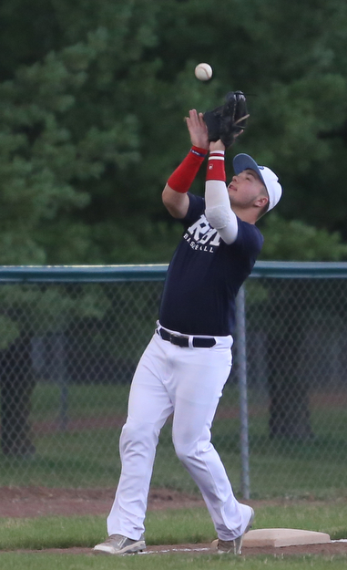 Roth third baseman Tyler Srbinovich(13) catches out the batter during the 6th inning as Roth Brothers takes on Baird Brothers, Friday, June 30, 2017 at Bob Cene Park. Play was stopped in the 6th inning due to a lightning delay then never resumed because of heavy rain...(Nikos Frazier | The Vindicator)..