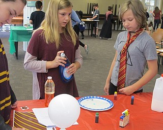 Neighbors | Alexis Bartolomucci.Children used milk, soap and food coloring to make a tye dye effect on a plate during the Hogwarts Summer School program on June 21.